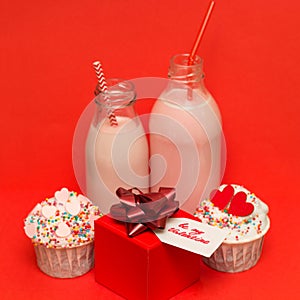pink strawberry milkshake in bottles cocktail straws, cute cupcakes ,gift box