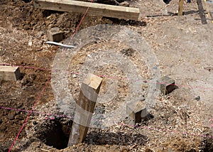 Pink string-lines cross on building site