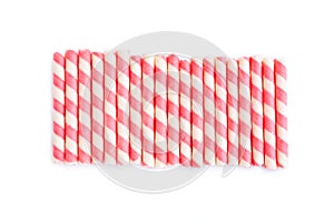Pink striped wafer stick rolls on white background