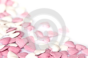 Pink sugar hearts on white