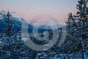 Pink sunrise color above Cascade mountain in Canadain Rockies