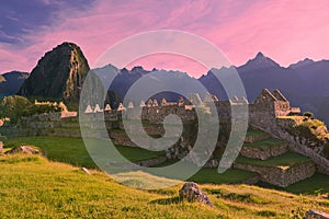 Pink sunrise light over machu picchu