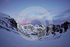 Pink sunrise over the snow covered High Atlas mountains