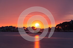 Pink sunset on the beach of Ploumanach in Perros-Guirec, Cotes d\'Armor, Brittany France