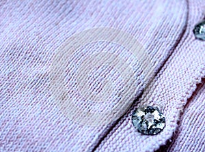 Pink sweater with decorative button