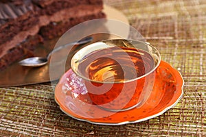 Pink tea in pink gold-coated cup On a pink saucer and a silver spoon On Valentine `s Day