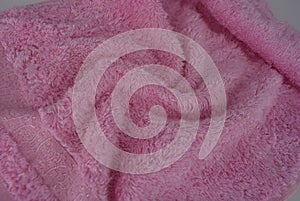 Pink terry towel, bamboo cloth, bamboo towel on a white background