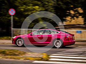 Pink Tesla Car in hurry