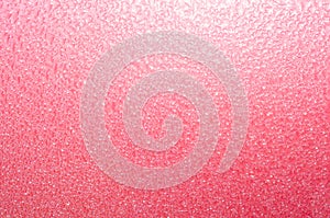 Pink textured abstract background with sparkle and shine.