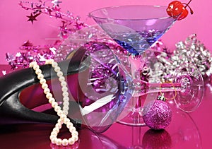 Pink theme Happy New Year party with vintage blue martini cocktail glass and New Years eve decorations after the party