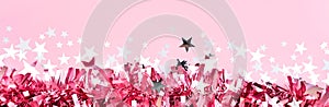 Pink tinsel decor background. Christmas Holiday greeting banner template