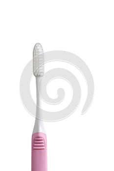 Pink toothbrush isolated on white background. Copy space with clipping path