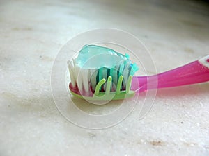 Pink toothbrush and paste