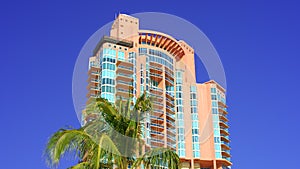 Pink tower Portofino Miami Beach Condominium on blue sky 4k HDR