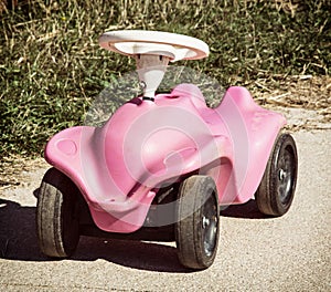 Pink toy car in outdoor