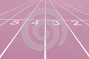 Pink track and field lanes and numbers. Running lanes at a track and field athletic center. Horizontal sport theme poster, greetin