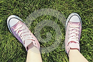 Pink trainers on grass