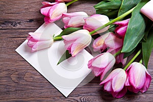 Pink tulips with postcard