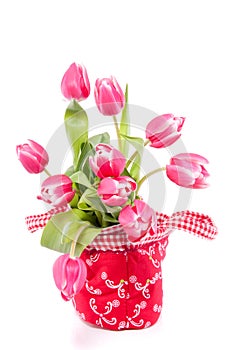 Pink tulips in a red bag