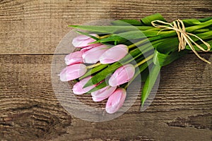 Pink tulips on the wood