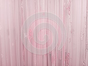 Pink tulle curtains with  pattern. Background texture