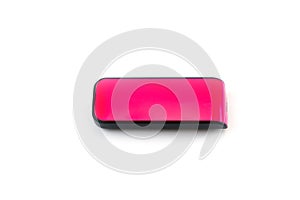 A pink USB flash drive with a plastic case, shot against a white background