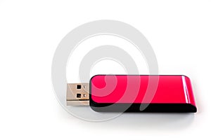 A pink USB flash drive with a plastic case, shot against a white background