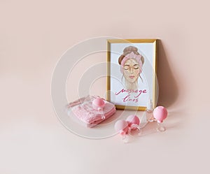 Pink vacuum jars for face fitness and anti-wrinkles face massage. Scheme of massage lines of the face in a wooden frame