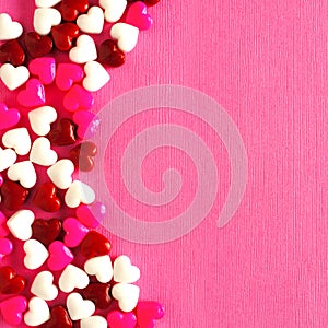 Pink Valentines Day background with candy heart border