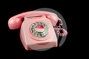 Pink Vintage Telephone on a Black Background