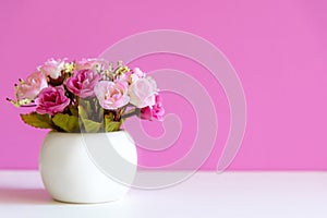 Pink wall with flower pink rose on shelf white wood, copy space for text