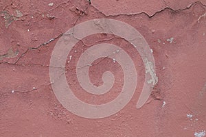 Pink wall texture with peeling paint.