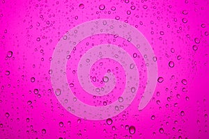 Pink water drops on the mirror