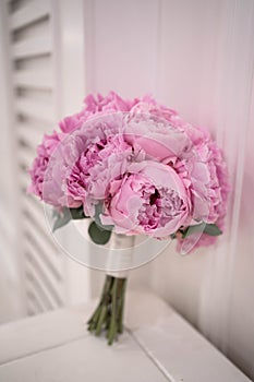 Pink wedding bouquet of peony. Sarah Bernhardt peonies. Wedding day.