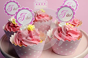 Pink wedding cupcakes with I Do topper signs - horizontal. photo