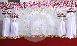 Pink and white backdrop flowers arrangement ready for wedding.
