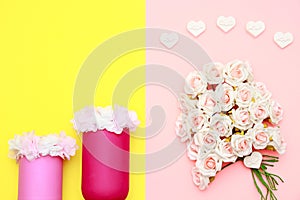 Pink white bouquet of roses, heart shaped stones and flowers on the jars with yellow background, mothers day celebration
