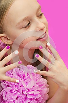 Pink white children`s manicure .