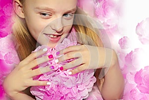 Pink white children`s manicure .