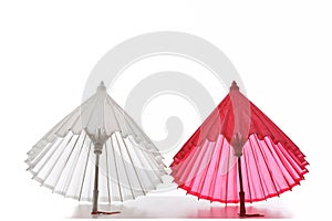 pink white Cocktail Umbrellas on White Background