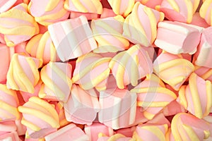 Pink and white marshmallows as background, top view. Dessert pastel colors, sweet food