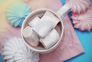 Pink and White Marshmallows zephyr with Cup of Coffee or Cocoa on a pink Napkin