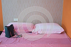 Pink and white pillow pink blanket in bedroom