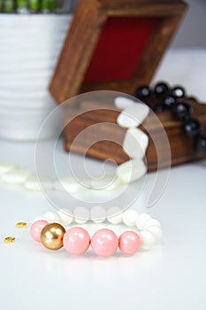 Pink and white bracelet in Wooden Box