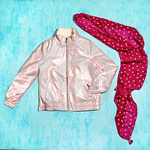 Pink woman jacket with a red scarf