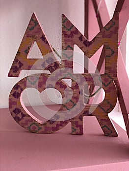 Pink wooden handmade decoration of AMOR for a girly bedroom