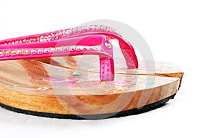 Pink wooden sandals photo
