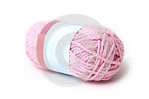 pink wool bobin on white background