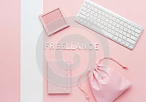 Pink workspace flat lay with keyboard and notebook isolated on white background