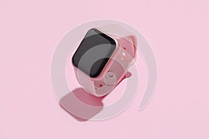 Pink wrisk watch on pink background